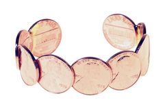 a close up of a bracelet made out of penny coins on a white background with clippings