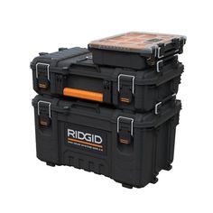 three black storage boxes stacked on top of each other with the lid open and two orange handles