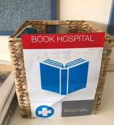 a basket with a book hospital sign on it