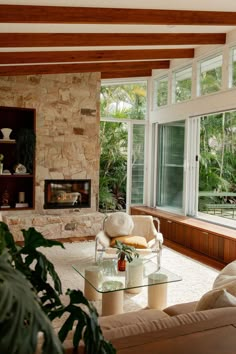 a living room filled with furniture and a fire place