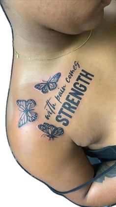 a woman's stomach with butterflies on it and the words strength written in black ink