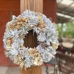 a close up of a wreath on a post