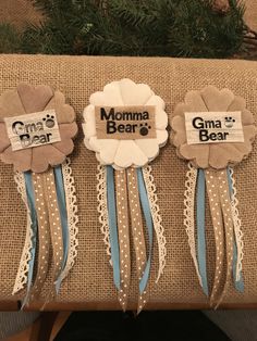 three ribbons with the words momma bear and grandma bear on them are sitting next to each other