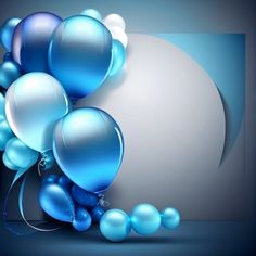 a bunch of blue balloons are in front of a large white ball and some silver balls