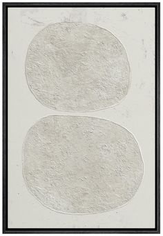 two oval shapes on a white background with black trim around the edges, framed in a black frame