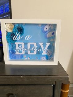 there is a picture frame that says it's a boy