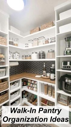 an organized pantry with white shelves and baskets