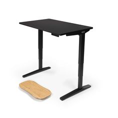 a computer desk with a wooden board on the bottom and black legs, against a white background