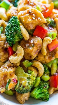 chicken and broccoli stir fry on a white plate