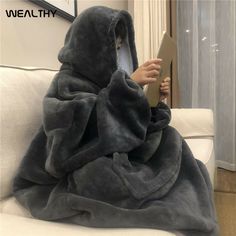 Material: Polyester  Season: Winter Sleeve Style: Regular Sleeve Length(cm): Full Hooded: Yes Thickness: Fleece Fabric Type: Fleece Model Number: AJA00203 Type: Pullovers Pattern Type: Solid Clothing Length: Long Style: Casual Age: Ages 18-35 Years Old Collar: Hooded Blanket Hoodie: Blanket Sweatshirt TV Blanket: TV Blanket Hoody Robe: Bathrobe Women: Men\\Adults\\Kids\\Children Hoodie Blanket, Wearable Blanket, Blanket Wrap, Soft Hoodie, Hooded Blanket, Hooded Sweater, Oversize Hoodie, Cozy Blankets, Fleece Hoodie