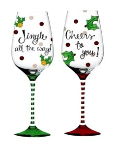 two wine glasses with christmas designs on them