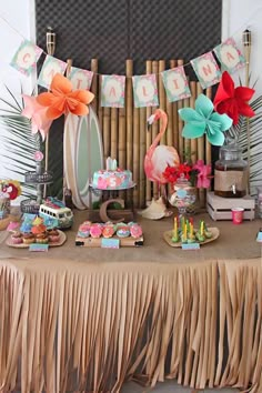 a table topped with lots of desserts and decorations