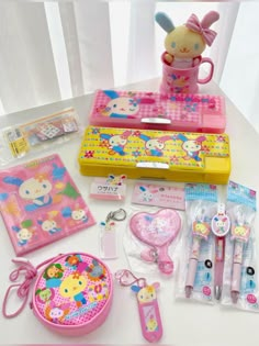 hello kitty stationery and accessories are on the table with it's pink case