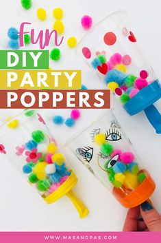 two plastic cups filled with colorful pom poms and the words fun diy party poppers