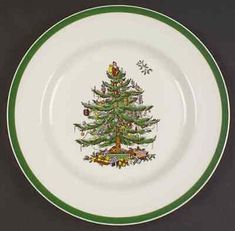 a green and white plate with a christmas tree on it