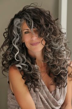 Curly Hair Gray Highlights, Curly Rocker Hair, Gray Curly Hair Natural Curls, Curly Grey Hair Natural Curls, Grey Hair Natural, Curly Grey Hair, Curly Silver Hair, Middle Part Curly Hair, Ash Highlights