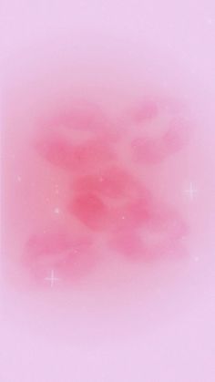 a pink background with stars in the middle and some clouds on it's side