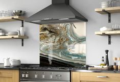 a stove top oven sitting inside of a kitchen next to wooden cabinets and open shelves