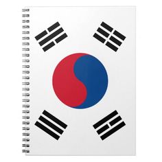 a spiral notebook with the flag of south korea and two black stripes on it's cover