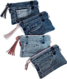 three pieces of blue jeans with tassels on them