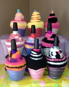 there are many knitted ice cream cones on the table