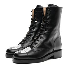 This is an authentic pair of CHANEL Calfskin Lace Up Combat Boots size 37.5 in Black. These stunning boots are crafted of calfskin leather in black. The boots feature a 1.25 inch heel and a leather cap toe with a stitched Chanel CC logo. Lace Up Combat Boots, Leather Cap, Cc Logo, Combat Boots, Calf Skin, Chanel, Lace Up, Thing 1, Boots