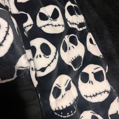 the black and white blanket has skulls on it