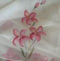 pink flowers on white sheer fabric with water drops falling off the petals and stems in the center