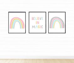 three posters with the words believe in magic and rainbows are hanging on a wall