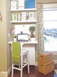 a room with a desk, chair and bookshelf on the wall next to a window