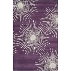 a purple rug with white flowers on it