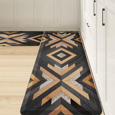 the floor is made out of wood and has geometric designs on it