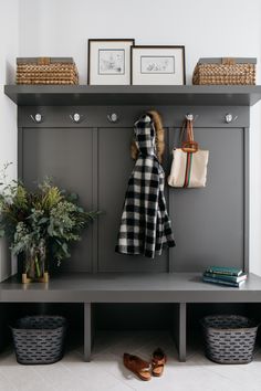 an image of a coat rack with shoes and purses on the shelf next to it