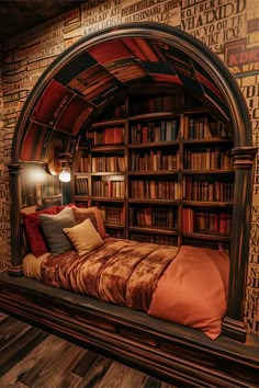 a bed in a room with bookshelves and pillows