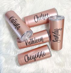 three personalized copper tumblers with names on them