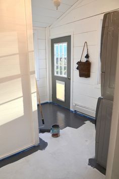 an open door leading into a white room