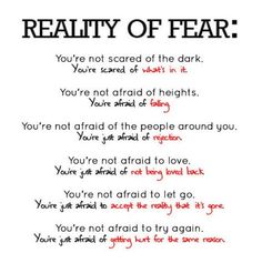 a poem with the words reality of fear written in red and black ink on white paper