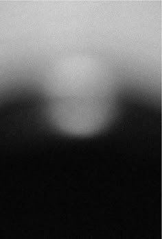 blurry image of an object in black and white