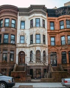 a row of multi - family houses on a city street