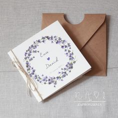 an envelope with a card that says, eva david on the front and purple flowers on the back