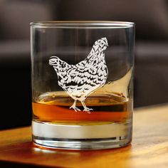 a glass with a chicken drawn on it