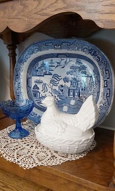 a blue and white plate with a chicken on it