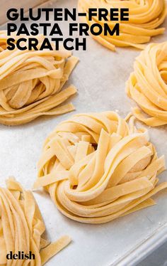 four uncooked pastas on a baking sheet ready to be put in the oven