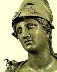 a close up of a statue of a woman wearing a hat