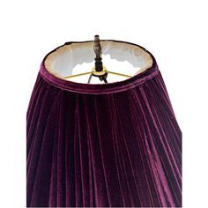 a purple lamp shade on a white background