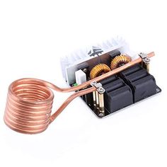 an electric device with copper wires and two coils attached to the back of it