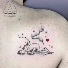 a man's back with a bear and stars tattoo on his left side shoulder