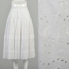 This listing is for an angelic little white cotton skirt by Gunne Sax. A classic cottagecore piece, this skirt is perfect for spring and summer, can look great layered with a cardigan or with a crop top! It has an elastic waistband, a dropped waist, and delicate eyelet embroidery around the hem.  Condition: Very Good Condition Details: There is some very very subtle discoloration along the waistband. One small faint almost unnoticeable spot at the back waist area. This skirt presents beautifully!  Size Marked: Unmarked Approximate Size: Small/Medium **Please Check Measurements to be Sure! Textile: 100% Cotton Lining Type: Unlined Closure: Pull-On Elastic Waistband Label: Gunne Sax by Jessica McClintock Era: 1980s Measurements- Waist:  24"-30" Hips at Dropped Waist Seam:  38" Hips 9" Below Gunne Sax Skirt, White Cotton Skirt, Eyelet Embroidery, Scallop Hem, Jessica Mcclintock, Vintage Rock, Gunne Sax, Hem Skirt, Skirt White