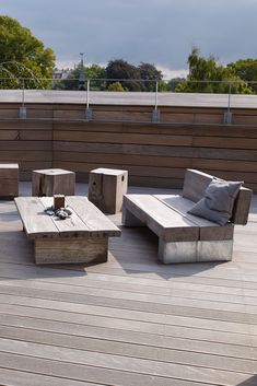 an outdoor seating area on a wooden deck