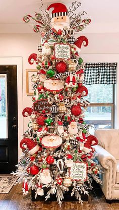 a christmas tree decorated with ornaments and candy canes is shown in the living room